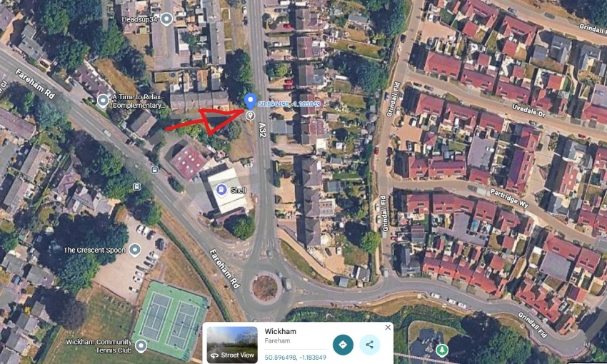 Satellite map showing the temporary A32 bus stop near the Shell garage roundabout in Wickham, marked with a red arrow.